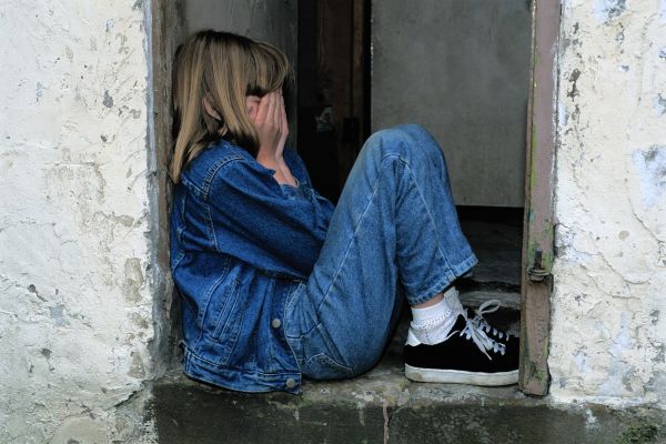 child is sitting jeans